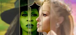 Zwei Gesichter: links grün mit Hut, rechts blass mit Krone, durch goldenen Rahmen getrennt.