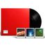 Text: "Nine Inch Nails." Eine schwarze Vinylplatte in einem roten Cover mit drei Konzertfotos darunter.