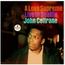 Texte: "A Love Supreme", "Live In Seattle", "John Coltrane". 
Logo: "impulse! STEREO". 
Mann blickt zur Seite. Retro-Stil.
