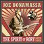"JOE BONAMASSA. THE SPIRIT OF RORY. LIVE FROM CORK." Illustration eines Gitarristen vor strahlenförmigem Hintergrund.