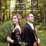 "BÉLA BARTÓK 44 DUOS Including Bartók’s original field recordings. Alexandra Preucil | Antoine Tamestit." Zwei Personen im Wald mit Streichinstrumenten.