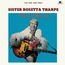 Oben steht: "THE ONE AND ONLY SISTER ROSETTA THARPE." Unten "Precious Memories." Eine Frau mit Gitarre vor blauem Hintergrund.