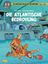 "Die Atlantische Bedrohung" ist der Titel. Zwei Männer in orangener Kleidung, einer kniet über dem anderen. Umgebung futuristisch.
