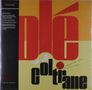 "Olé Coltrane" in großen Buchstaben, darunter "Coltrane" in Schwarz, mit rot-gelbem Hintergrund. Links Liste von Vinyl-Details.