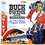 Text im Bild: "BUCK OWENS AND THE BUCKAROOS At The Mint Vegas 1968". Illustration mit Musikern, großen Schriftzügen und einem Gebäude., LP