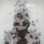 Text: "LINKIN PARK LIVING THINGS". Illustration eines Gesichts, das in weiße, fragmentierte Partikel zerfällt., LP