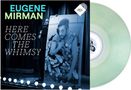 Text links: "Eugene Mirman", "Here Comes The Whimsy". Darunter eine Person mit einem Plakat, im Hintergrund Vorhang. Rechts: transparente Schallplatte., LP