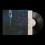 Texte: "his name is alive", "HOME IS IN YOUR HEAD". Dunkler Hintergrund, skulpturartige Figur links, Vinyl-Schallplatte rechts., LP