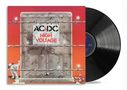 Text: "AC/DC High Voltage". Im Vordergrund eine Mauer mit Stacheldraht; ein Hund und ein zerbrochenes Straßenschild., LP