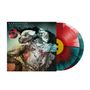 Text: "KARNIVOOL ASYMMETRY", "ASYMMETRY BLOT OF SYMMETRY VINYL".  
Illustration: Abstrakte Figuren mit Linien und verschwommenem Hintergrund.  
Vinyl-Schallplatte in Rot und Blau., 2 LPs