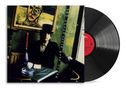 „BOB DYLAN World Gone Wrong“ ist schräg auf einem Cover abgebildet. Eine Schallplatte mit rotem Label ist teilweise sichtbar., LP