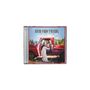 „LITTLE MISS TWAIN, SHANIA TWAIN“. Eine Frau sitzt in einem roten Truck vor einer Waldkulisse. CD-Cover., CD