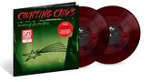 "Counting Crows recovering the satellites" auf einem Plattencover, rote Schallplatten daneben., 2 LPs