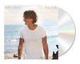 „keith urban“ und „flow state“. Ein Mann am Strand im weißen Shirt mit Tätowierungen, lächelt seitlich. CD-Beilage rechts.