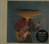 Text: "LONG LOST, The New Album from LORD HURON." Illustration: Person in rot mit Gitarre, Kopf verschwommen., CD