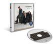 CD-Cover: "the cranberries - no need to argue." Vier Personen auf einem Sofa, schlichtes Zimmer, CD daneben.
