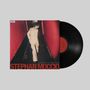 "Scenes From A Velvet Room" und "STEPHAN MOCCIO" auf einem Plattencover, Person im Anzug in rotem Gang, Vinyl links., LP