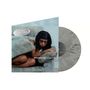 „emotional junglist“. Eine Frau liegt auf einem Sofa, sie sieht nachdenklich aus. Eine graue Schallplatte ist sichtbar., LP