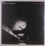 Text: "GAZ COOMBES", "LIVE IN PARIS". Silhouette eines Musikers mit Gitarre und Mikrofon vor hellem Licht., LP