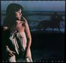 "Linda Ronstadt, Hasten Down the Wind". Eine Frau schaut nach links, ein Reiter im Hintergrund am Strand., LP