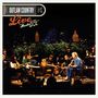 Text: "OUTLAW COUNTRY Live from Austin TX". Mehrere Musiker sitzen im Halbkreis mit Gitarren auf einer Bühne.