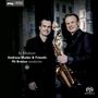 "In Motion Andreas Mader & Friends Pit Brosius conductor" steht auf dem Cover. Zwei Männer, einer mit Saxophon., Super Audio CD