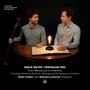 CONTAINS WORLD PREMIERE RECORDINGS. Zwei Männer am Tisch mit Notenbuch und Glühbirne., CD