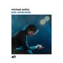 Text: "michael wollny eine winterreise". Ein Mann sitzt seitlich, in sich gekehrt, vor einem blauen Hintergrund. Links unten Logo "ACT"., LP