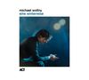 Text: "michael wollny, eine winterreise, ACT." Ein Mann sitzt gedankenversunken in bläulichem Licht., CD