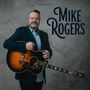 Der Text "Mike Rogers" ist groß. Ein Mann im Anzug hält eine akustische Gitarre vor einem neutralen Hintergrund., CD