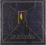 „THE TEAR GARDEN ASTRAL ELEVATOR“ in goldener Schrift. Eine Silhouette betritt eine gelb erleuchtete Tür., 2 LPs