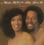 "Marilyn McCoo & Billy Davis Jr." und "The Two of Us". Zwei lächelnde Menschen stehen eng beieinander vor braunem Hintergrund., CD