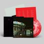 Rote Vinyl-Schallplatte, darauf: Liedtexte. Dunkles Cover zeigt ein Karussell bei Nacht., Single 12"