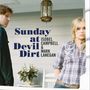 Text: „Sunday at Devil Dirt Isobel Campbell & Mark Lanegan“. Eine Frau und ein Mann auf einer Veranda, bei einem Tisch., CD