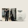 Auf der CD steht "HERE BECAUSE OF HOPE". Links drei Kinder in Anzügen, zwei stehen, eins sitzt., CD