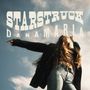 Der Text zeigt "Starstruck" und "Dana Maria". Eine Frau mit langen Haaren, in Jeans und schwarzem Mantel posiert unter einem blauen Himmel.