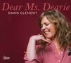 Text: "Dear Ms. Dearie" und "Dawn Clement". Frau in rot-weiß kariertem Hemd, lächelt mit geschlossenen Augen, roter Hintergrund., CD