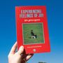 Roter Umschlag mit "EXPERIENCING FEELINGS OF JOY", Bild von Person auf Wiese, weißer Stuhl, blauer Himmel., LP