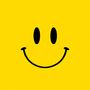 Gelber Hintergrund mit einem großen, schwarzen Smiley-Gesicht.