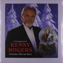 "Kenny Rogers in Christmas from the Heart." Ein älterer Mann im Anzug, winterlicher Hintergrund mit Schneekugel.