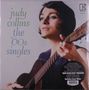 "judy collins the '60s singles" steht in verschiedenen Farben. Eine Frau spielt Gitarre und schaut nach oben.