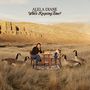 Text: "Alela Diane, Who's Keeping Time?" Frau sitzt an Tisch in Wiese, umrahmt von Gänsen, im Hintergrund felsige Landschaft., CD