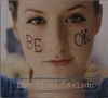 Auf den Wangen steht "BE OK", unten "ingrid michaelson". Ein Gesicht in Nahaufnahme blickt direkt., CD