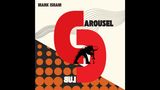 "Mark Isham" und "Carousel" oben, "Lub" unten gespiegelt. Abstrakte Formen, rote Spirale, schwarz-orange Kreise.