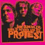 "Jon Spencer: Songs of Personal Loss and Protest" in oranger Schrift vor einem pinken Hintergrund. Drei Porträts., CD
