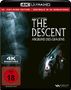 „THE DESCENT: ABGRUND DES GRAUENS“ in weißer Schrift, rot verzierter FSK 18 Hinweis, düsteres Gesicht im Hintergrund., 1 Ultra HD Blu-ray und 2 Blu-ray Discs