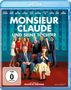 „Monsieur Claude und seine Töchter“. Zwei Personen sitzen, umgeben von einer Gruppe lächelnder Menschen in festlicher Kleidung.