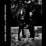 MANUEL SCHMID und MAREK ARNOLD. Zwei Personen in schwarzer Kleidung stehen vor einem dramatischen Gemälde., Single 7"