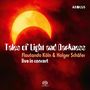 "Tales of Light and Darkness", Flautando Köln & Holger Schäfer live im Konzert. Sonnenfinsternis mit rotem Himmel im Hintergrund.