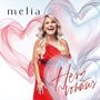 Der Text "melia" steht oben links, "Herz voraus" unten rechts. Eine blonde Frau in rotem Kleid lächelt vor bunten Herzen., CD